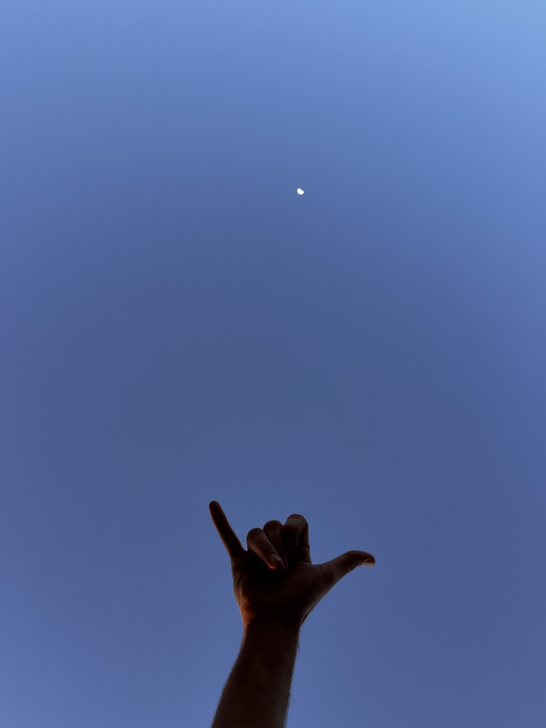 A hand toward the moon